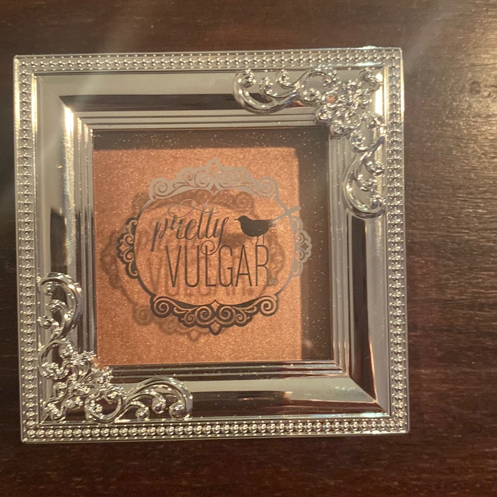 Pretty Vulgar shimmering swan highlighter in Glow Up